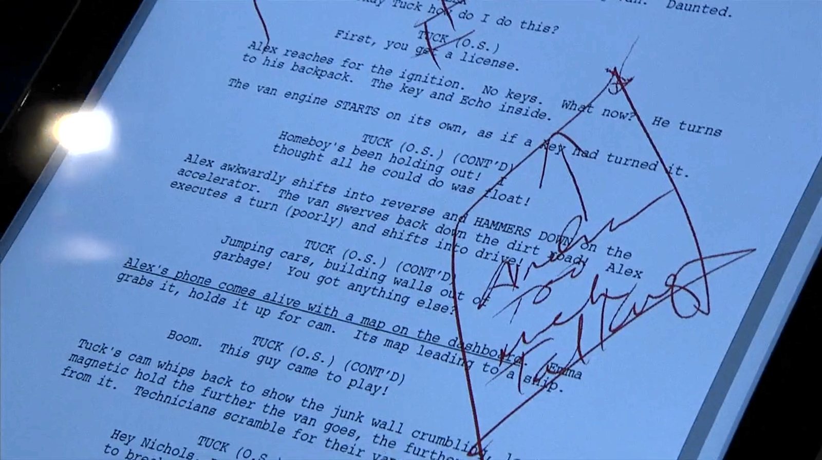 Two lines in the script have red crosses drawn over them, and a box with an arrow encloses a comment on a specific passage.